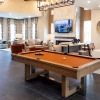Resident gathering spaces with fireplace and pool table at Riverchase Vista Savannah apartments.