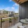 Private patio view of parking lot and community with chair